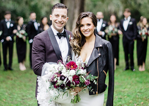 bride and groom deep red and white unique floral bouquet wedding florist