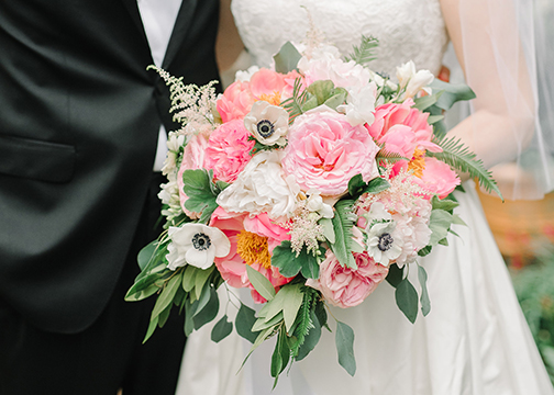 bridal bouquet being held by bride with her groom wedding flowers